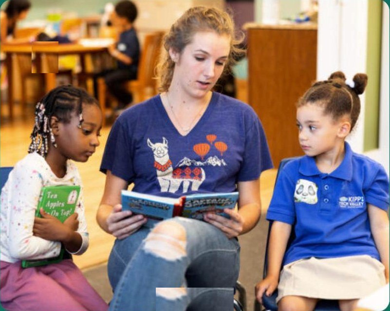 A teacher reading with students